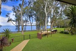 What a view::Kids can play safely in the fully fenced yard with lockable gate while you enjoy the view from the waterfront alfresco area